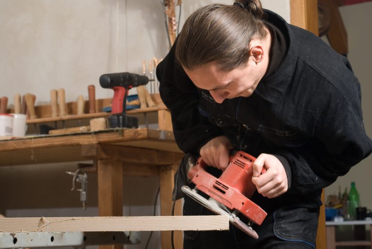 Carpenter building a workbench out of wood